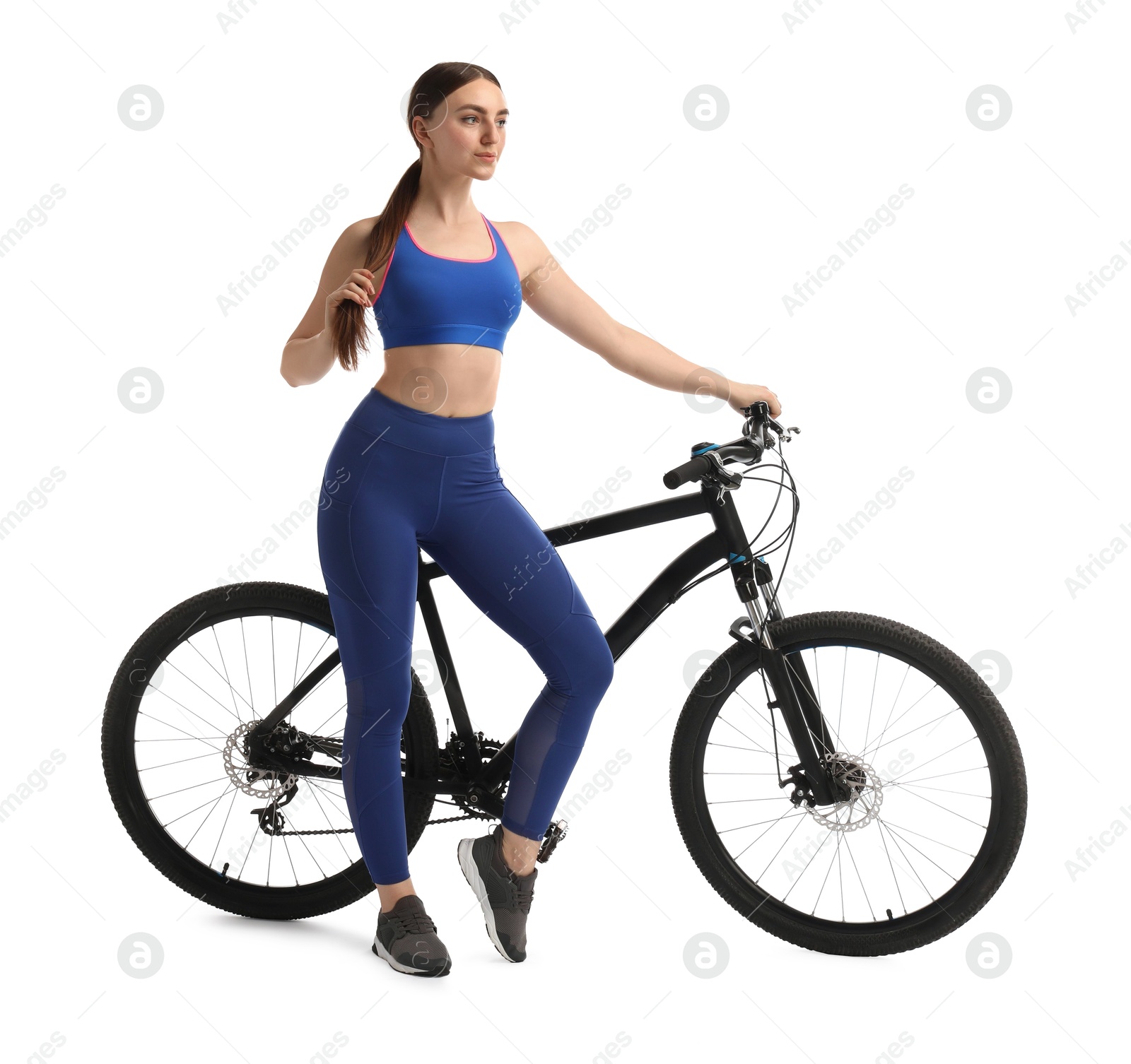 Photo of Beautiful young woman with bicycle isolated on white