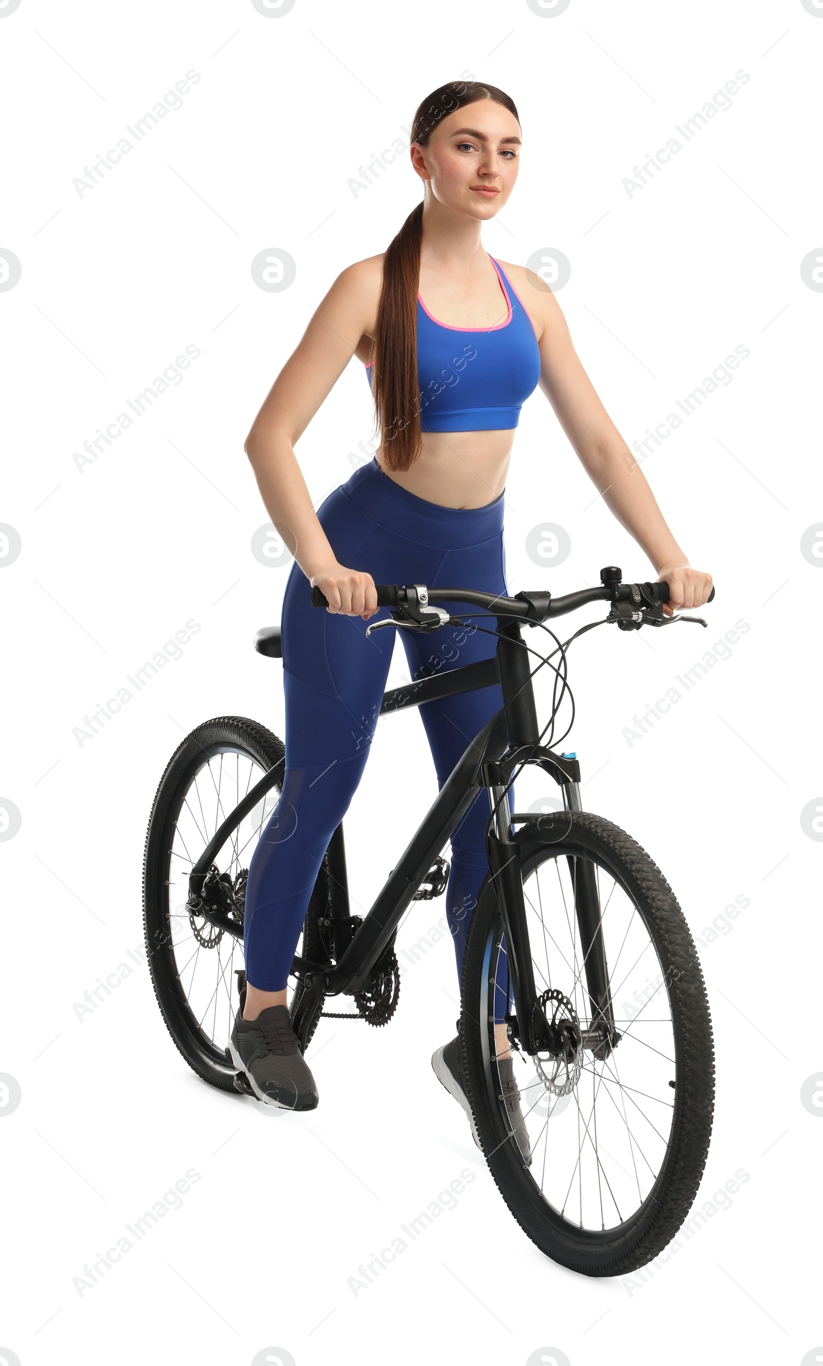 Photo of Beautiful young woman riding bicycle on white background