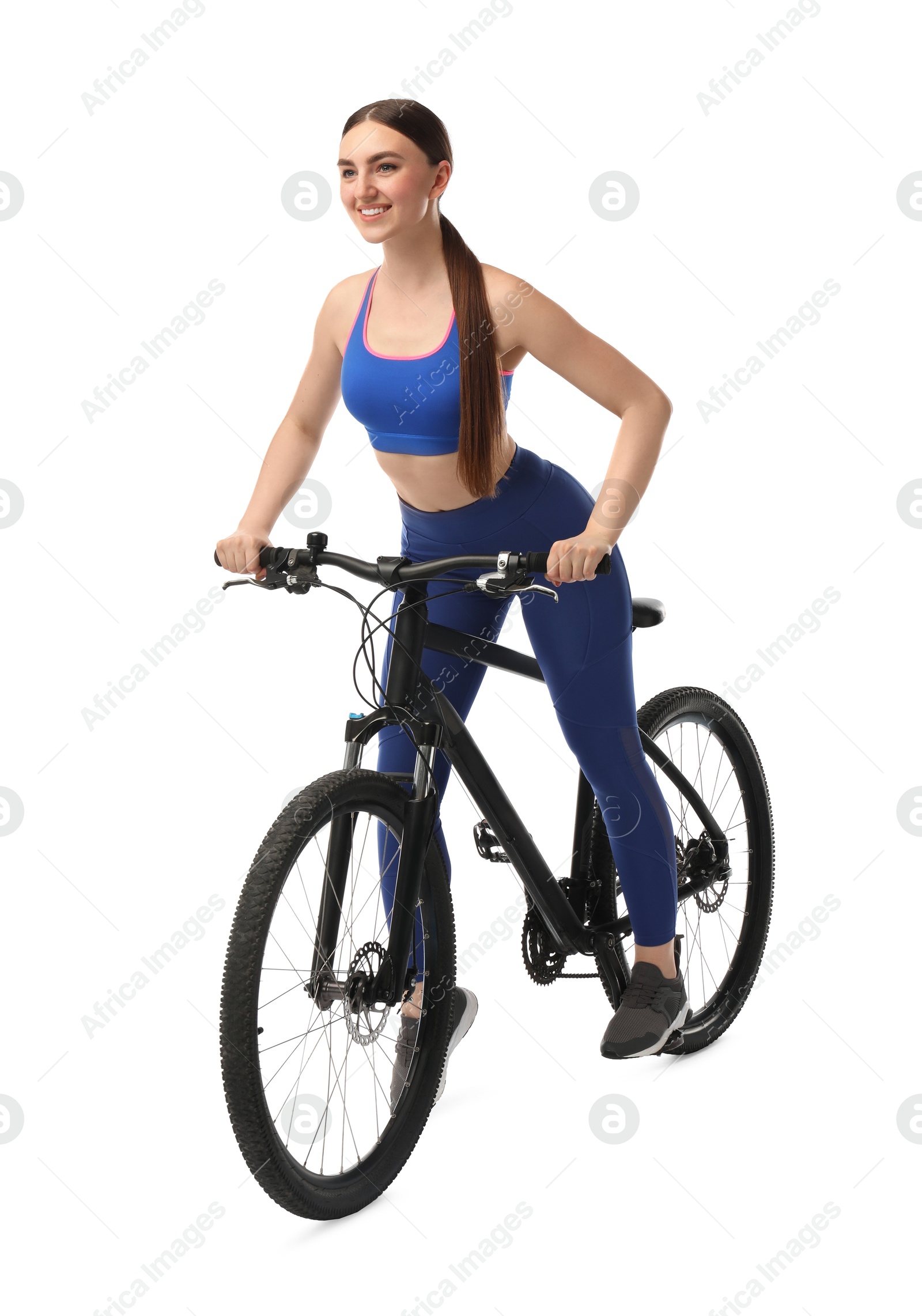 Photo of Smiling woman riding bicycle on white background