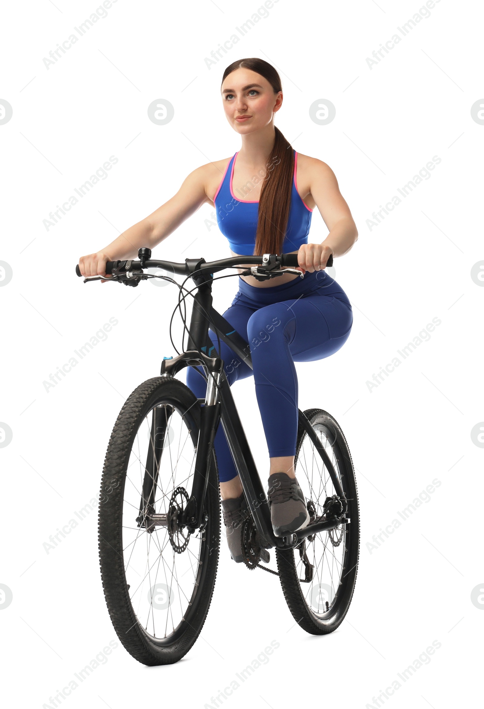 Photo of Beautiful young woman riding bicycle on white background