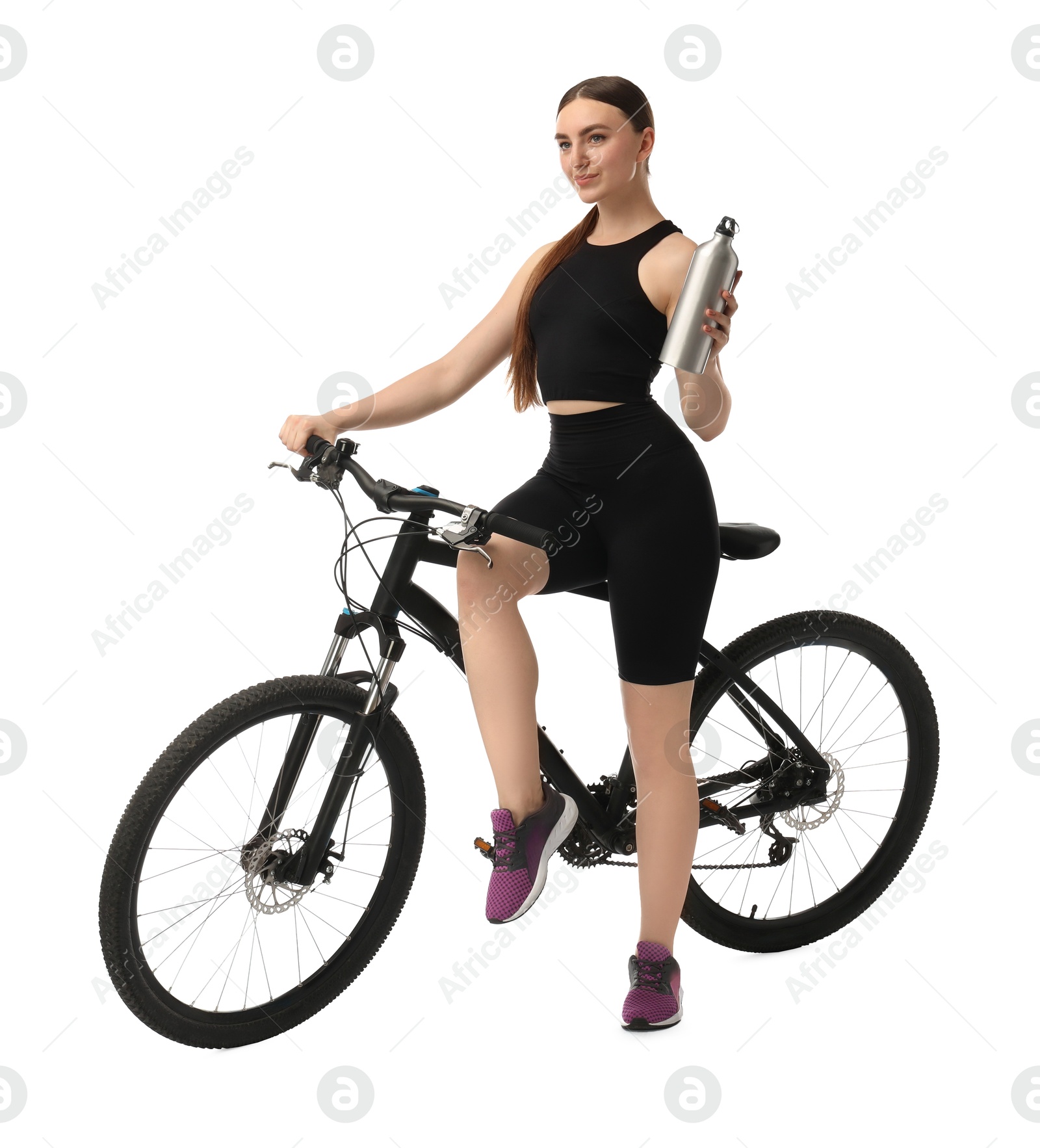 Photo of Beautiful young woman with bicycle and bottle of drink isolated on white