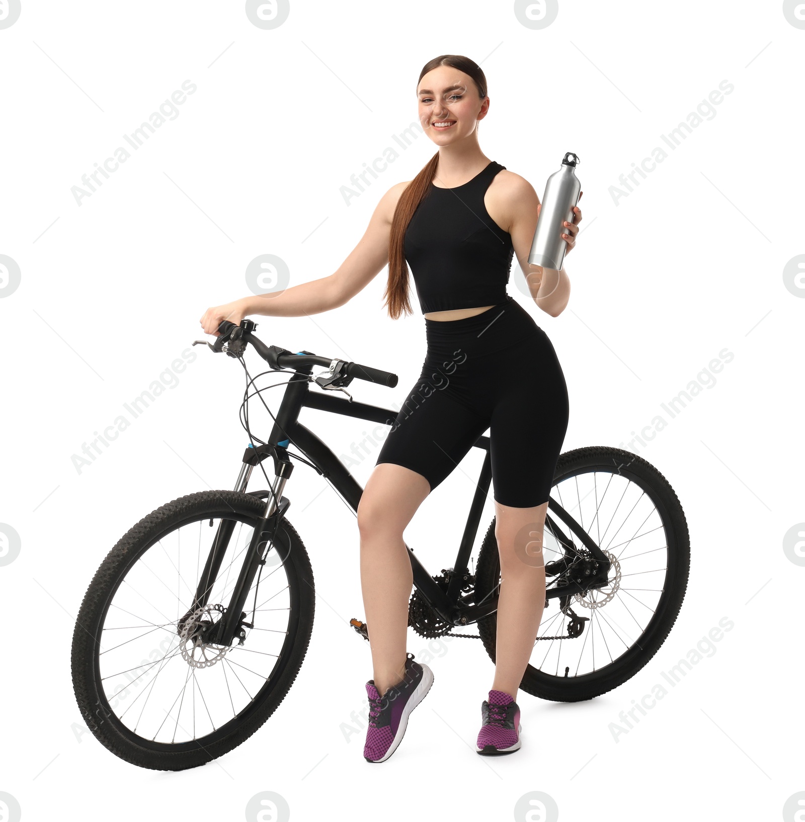 Photo of Smiling woman with bicycle and bottle of drink isolated on white