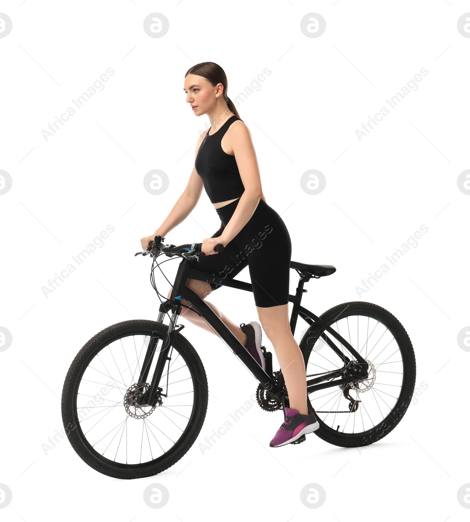 Photo of Beautiful young woman riding bicycle on white background