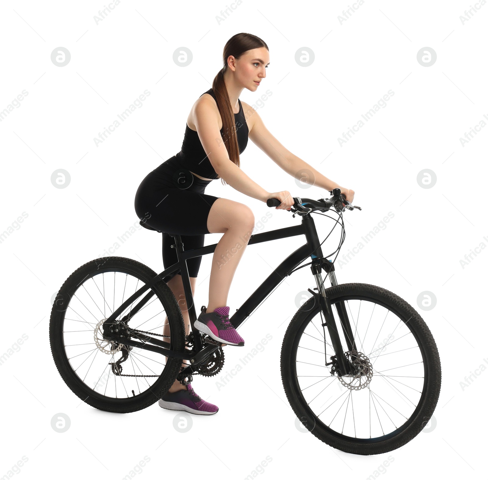 Photo of Beautiful young woman riding bicycle on white background