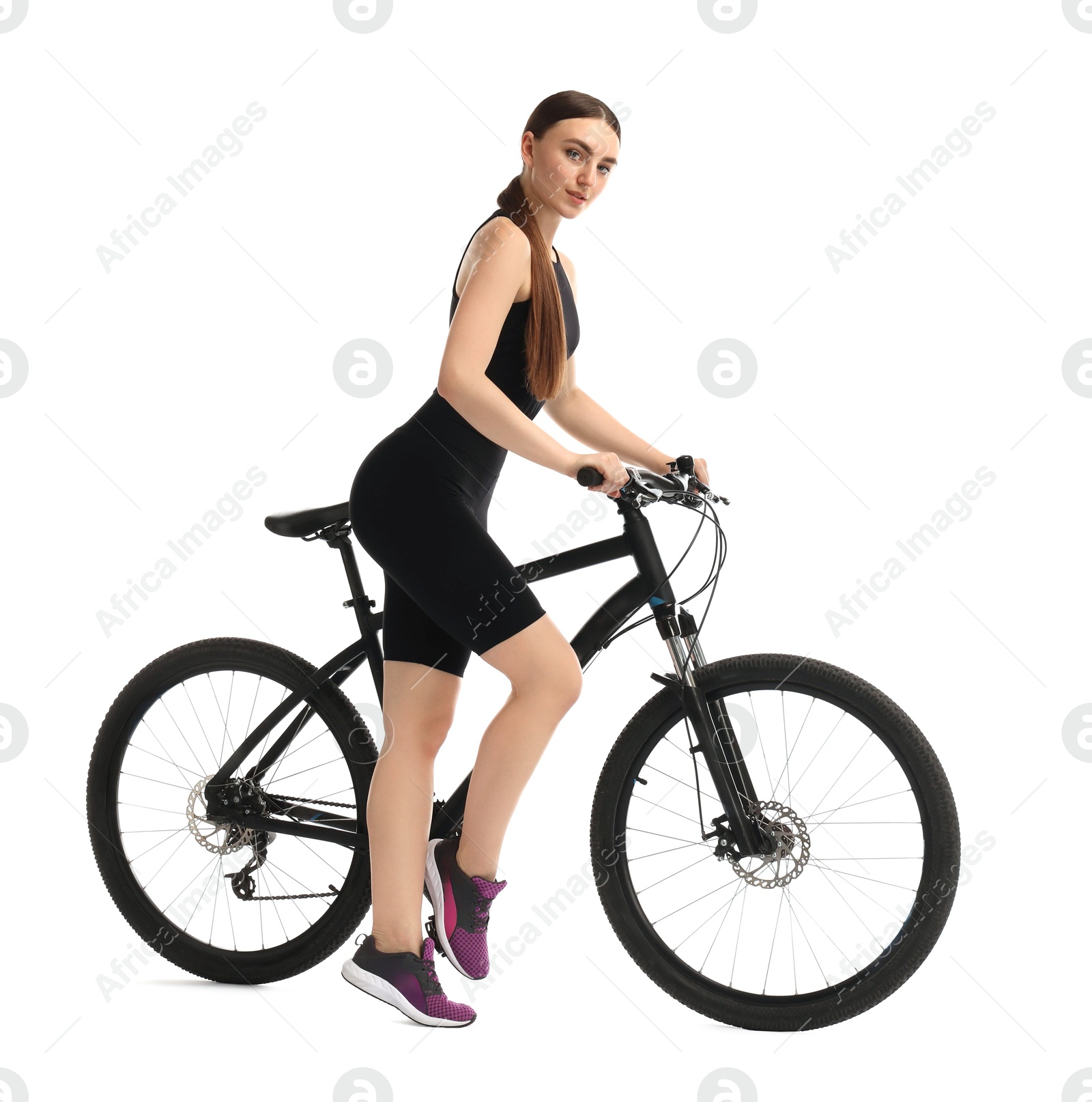 Photo of Beautiful young woman with bicycle isolated on white