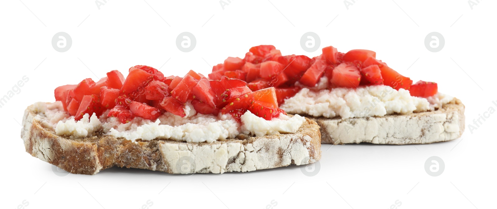 Photo of Delicious bruschettas with ricotta cheese and chopped strawberries isolated on white