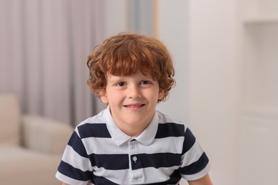 Photo of Portrait of little boy indoors. Cute child