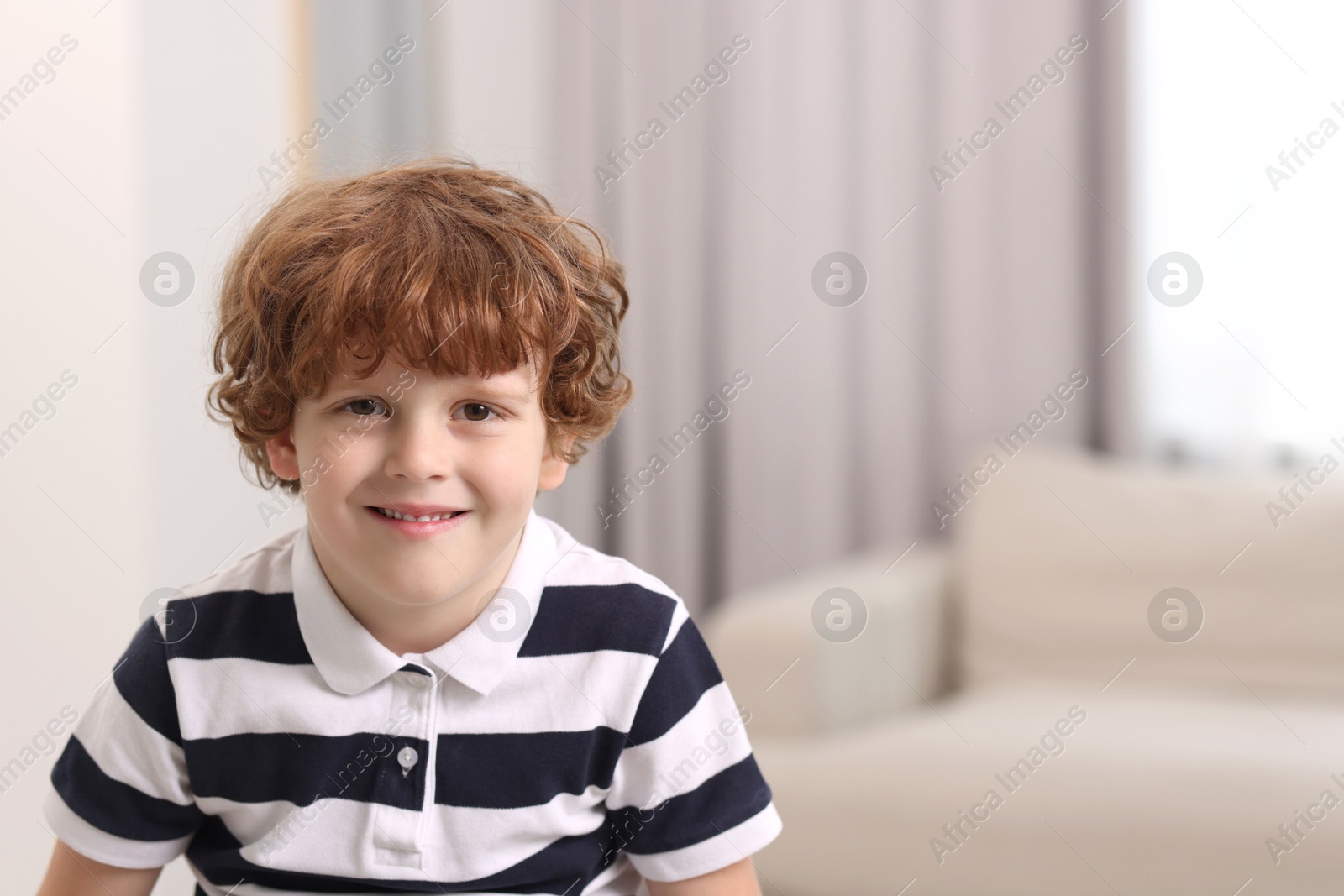 Photo of Portrait of little boy indoors, space for text. Cute child