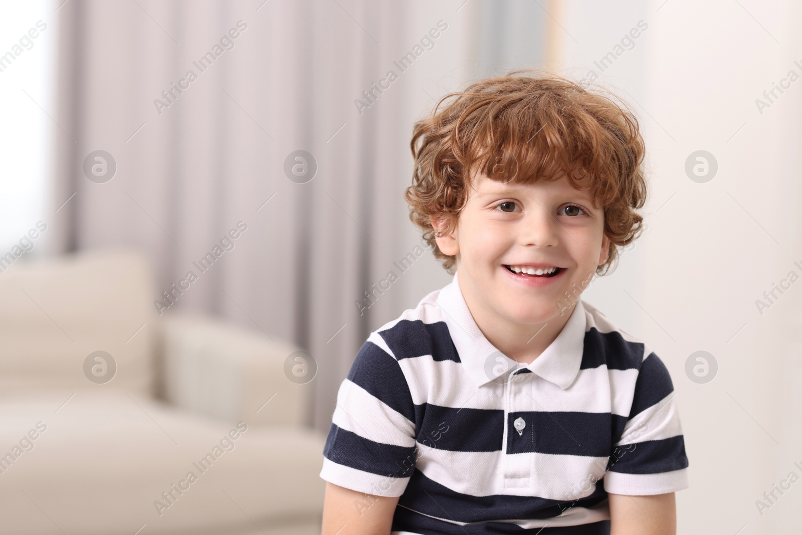 Photo of Portrait of little boy indoors, space for text. Cute child