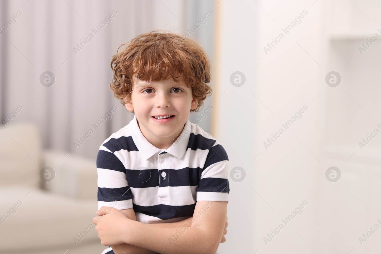 Photo of Portrait of little boy indoors, space for text. Cute child