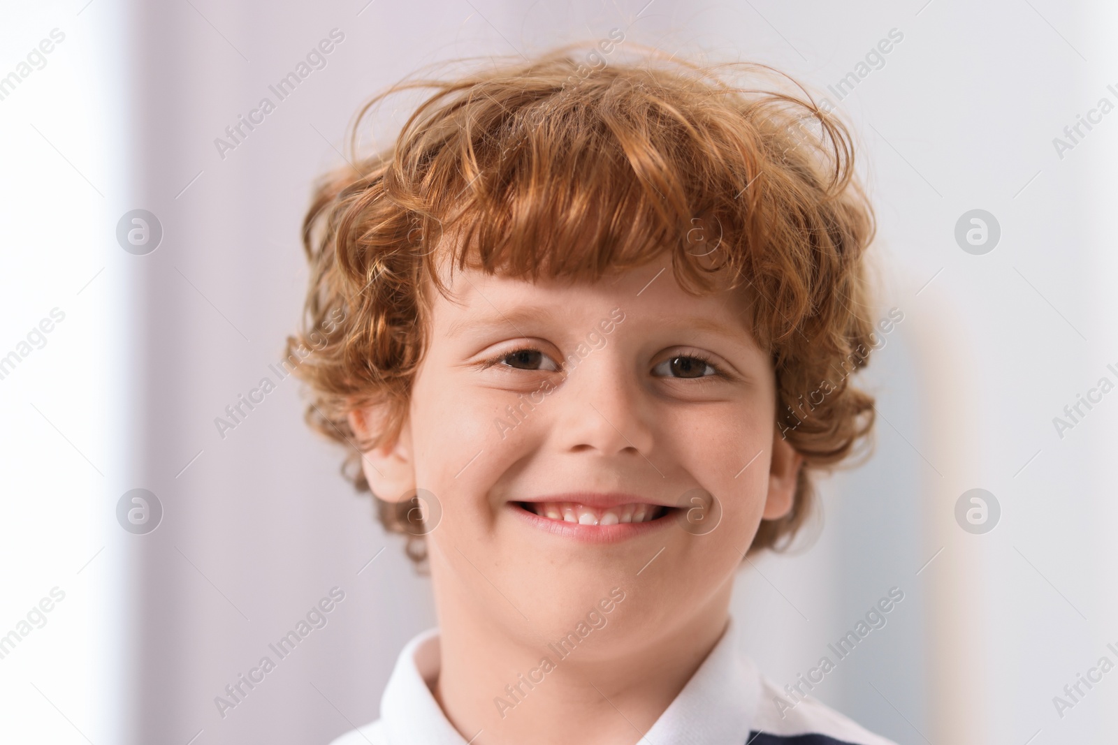 Photo of Portrait of little boy indoors, closeup. Cute child