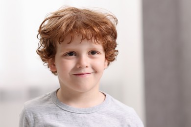 Photo of Portrait of little boy indoors, space for text. Cute child