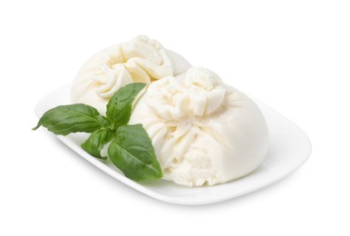 Photo of Delicious burrata cheese and basil isolated on white