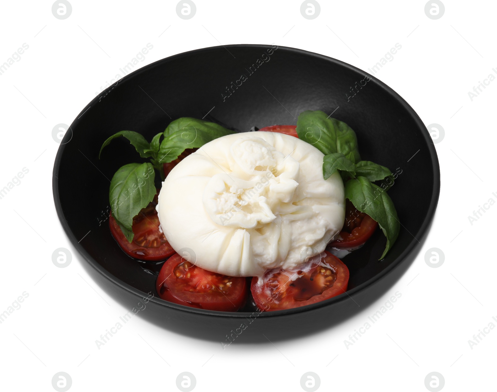 Photo of Delicious burrata cheese, tomatoes and basil in bowl isolated on white