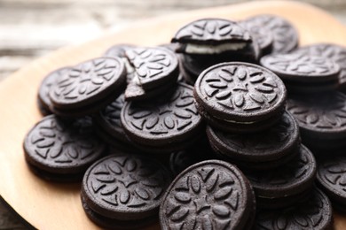 Many tasty sandwich cookies on table, closeup