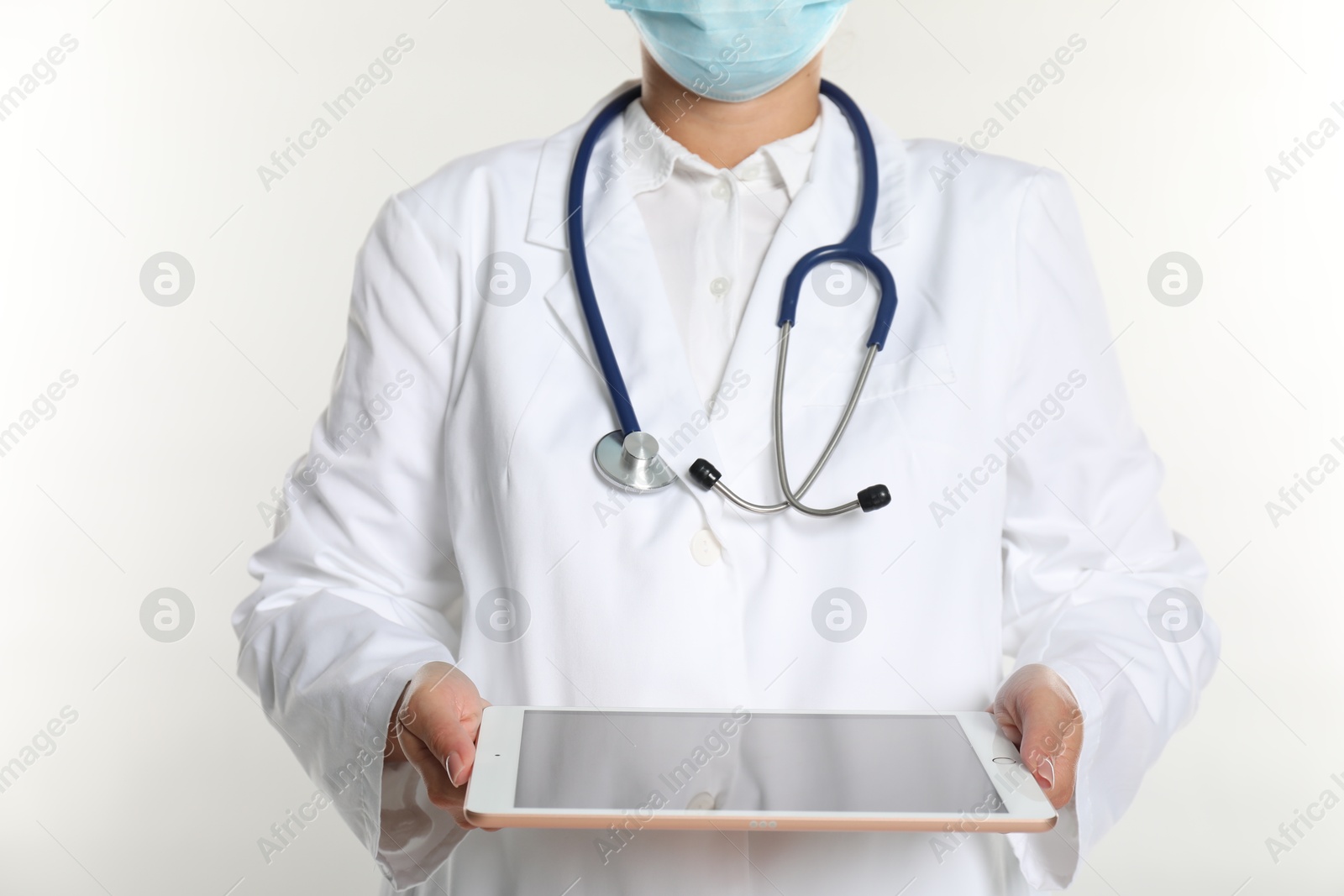 Photo of Doctor with tablet on white background, closeup view