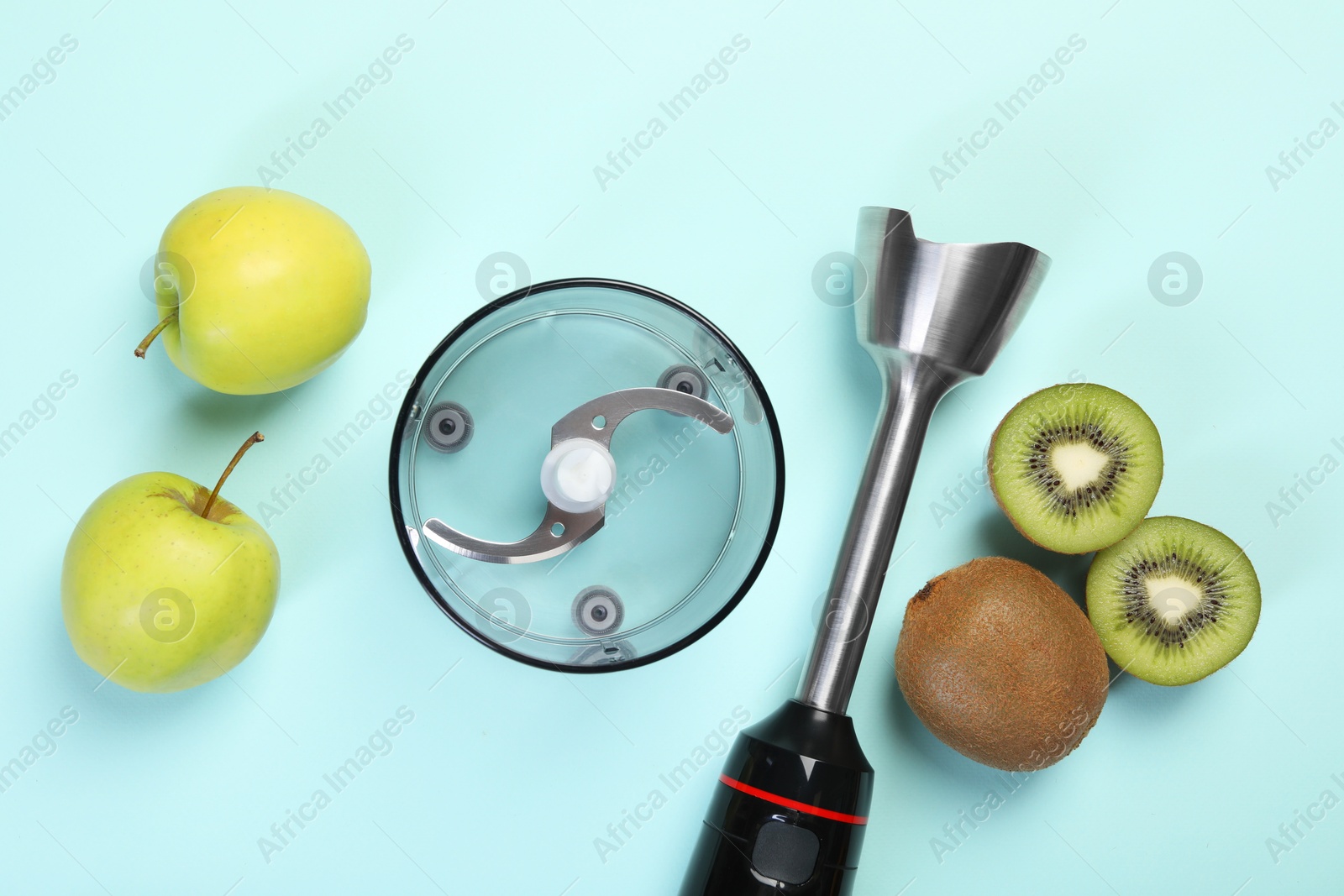 Photo of Hand blender kit and fresh fruits on light blue background, flat lay