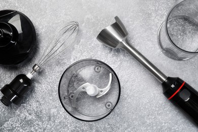 Photo of Hand blender kit on grey table, flat lay