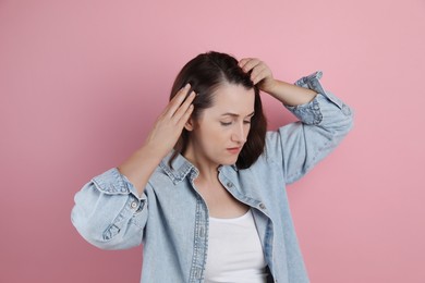 Photo of Woman with hair loss problem on pink background