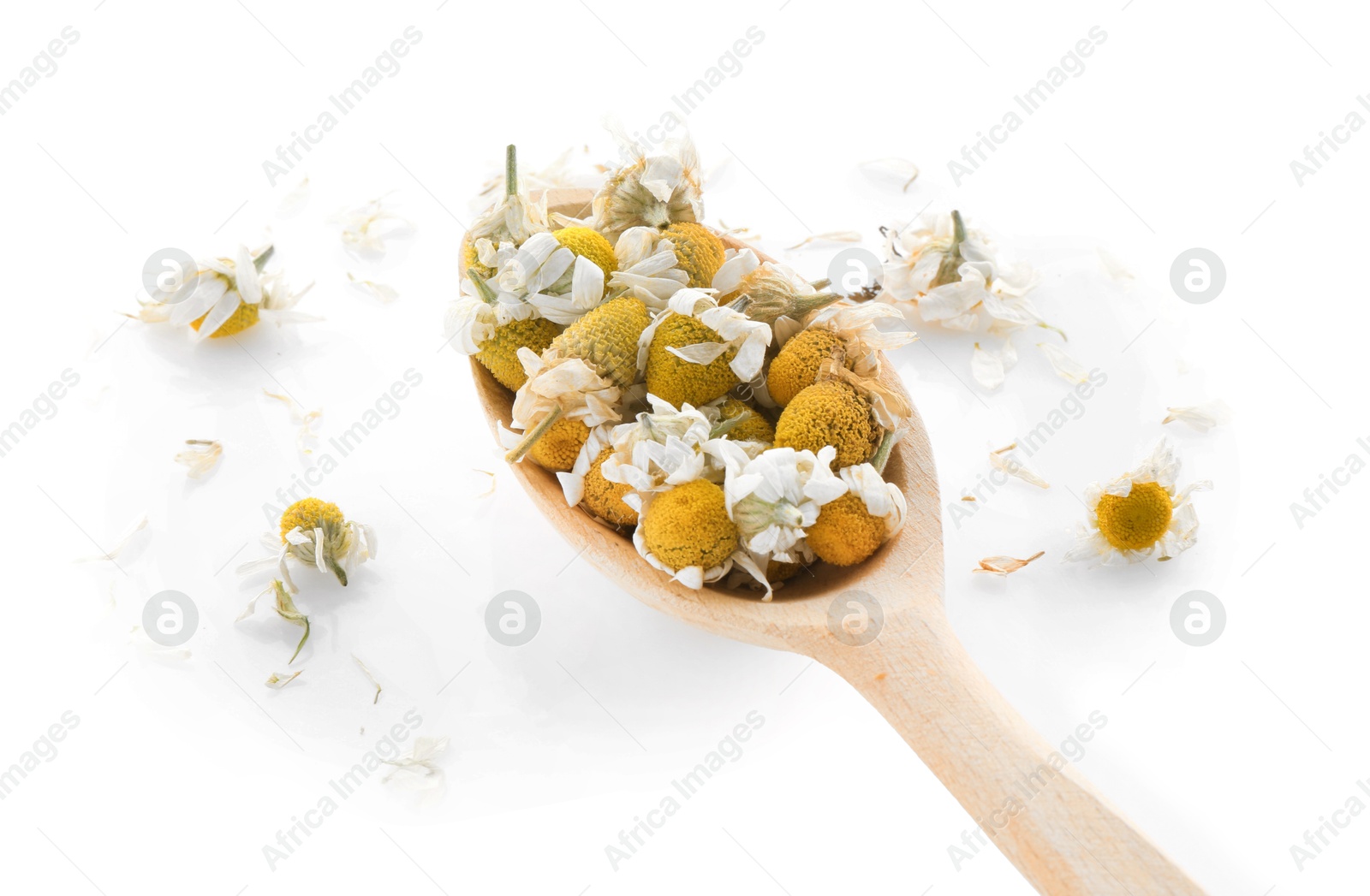 Photo of Chamomile flowers in wooden spoon isolated on white