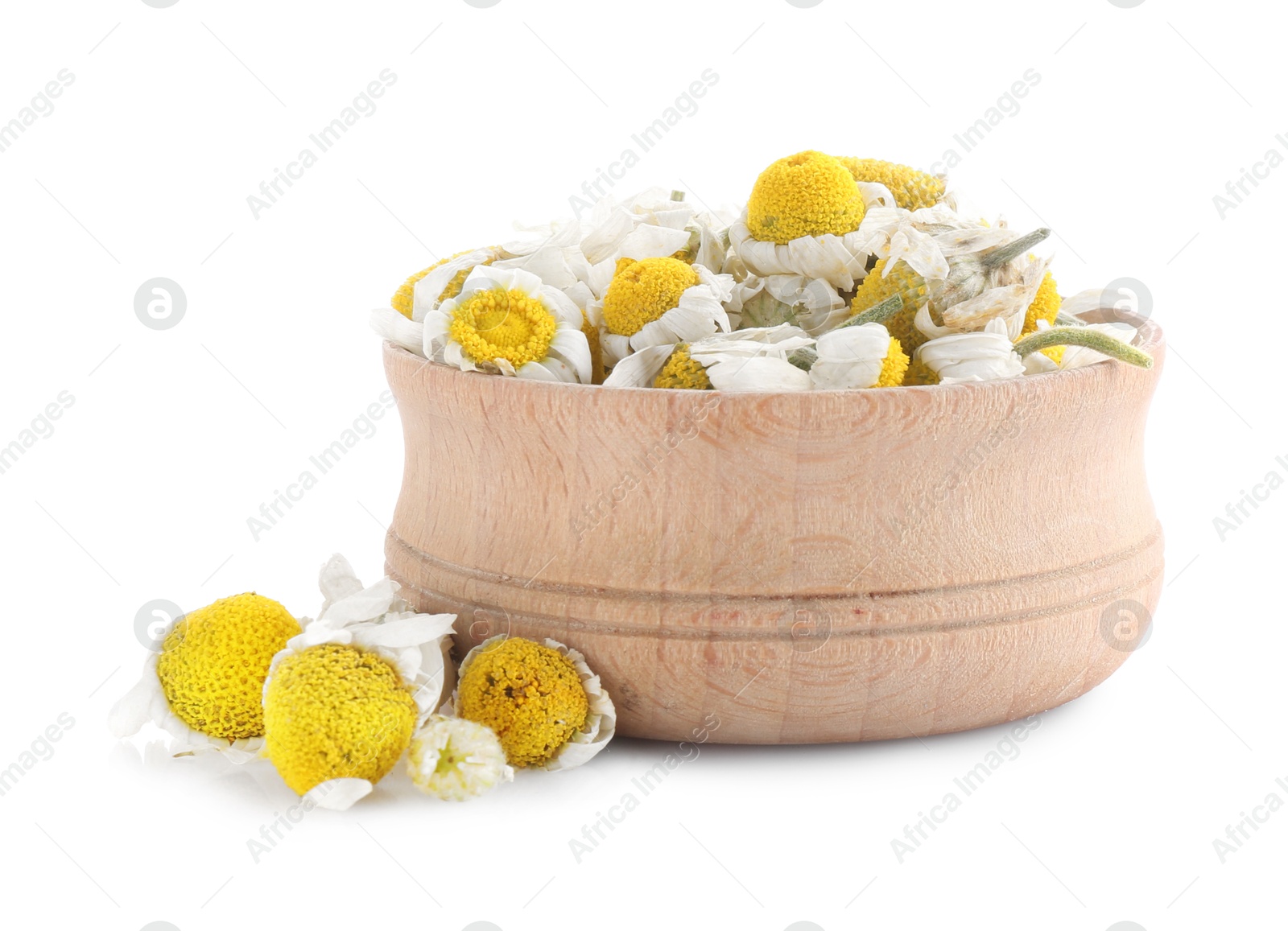 Photo of Chamomile flowers in wooden bowl isolated on white