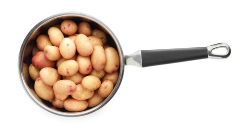 Raw potatoes in saucepan isolated on white, top view