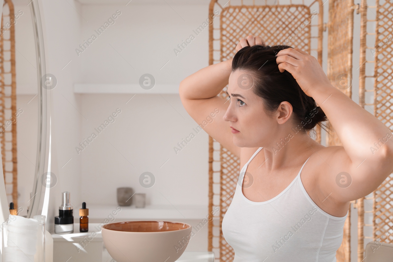 Photo of Woman with hair loss problem at home