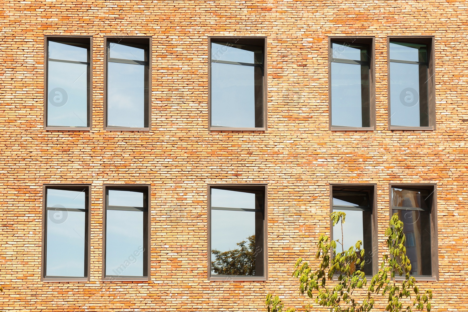 Photo of Exterior of brick building with glass windows