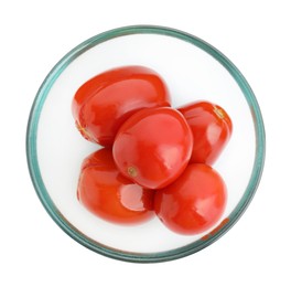 Photo of Tasty pickled tomatoes in bowl isolated on white, top view