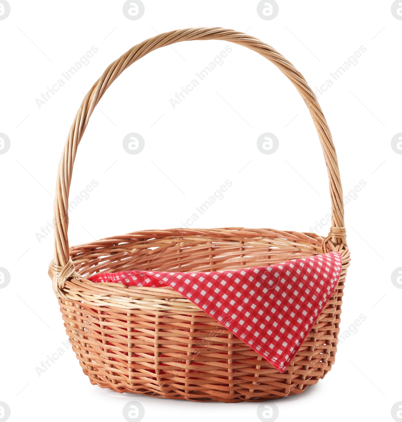 Photo of One picnic wicker basket with checkered napkin isolated on white