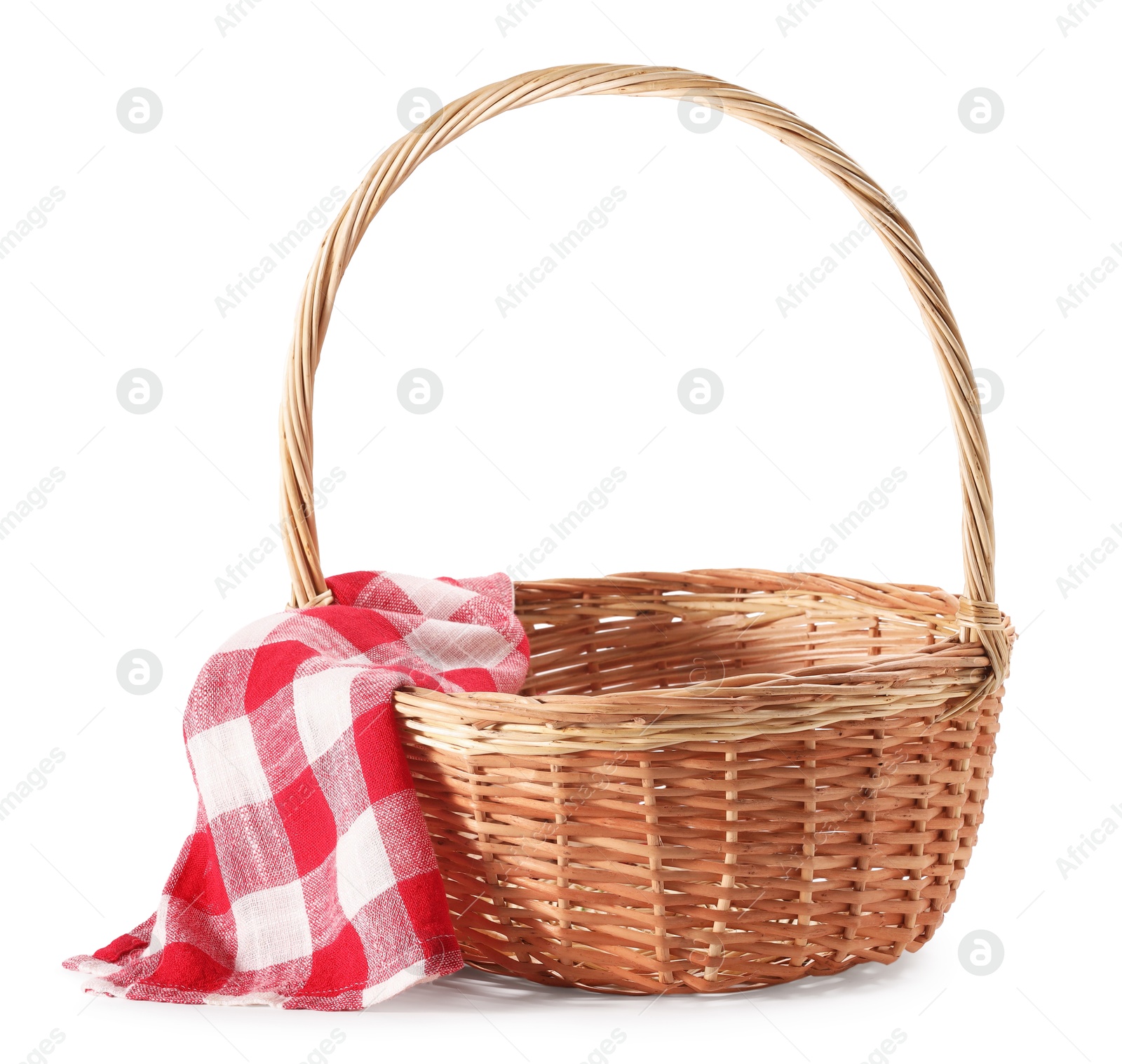 Photo of One picnic wicker basket with checkered napkin isolated on white