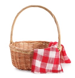 One picnic wicker basket with checkered napkin isolated on white