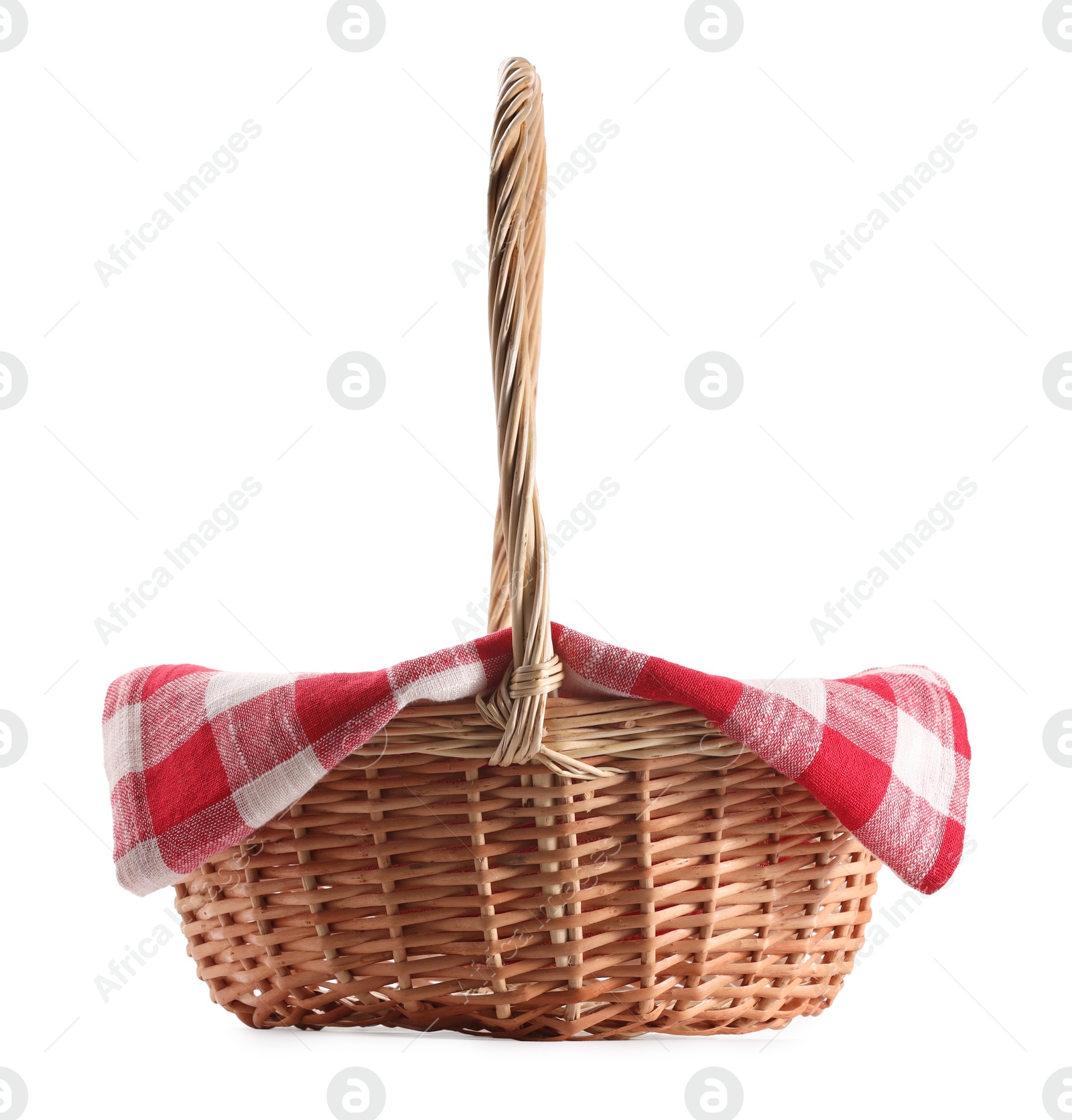 Photo of One picnic wicker basket with checkered napkin isolated on white