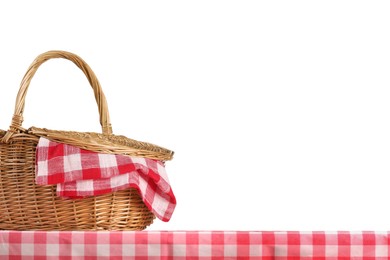 Photo of One picnic basket with napkin on table against white background. Space for text