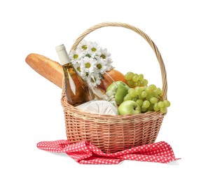 Photo of Picnic basket with flowers, food and wine isolated on white