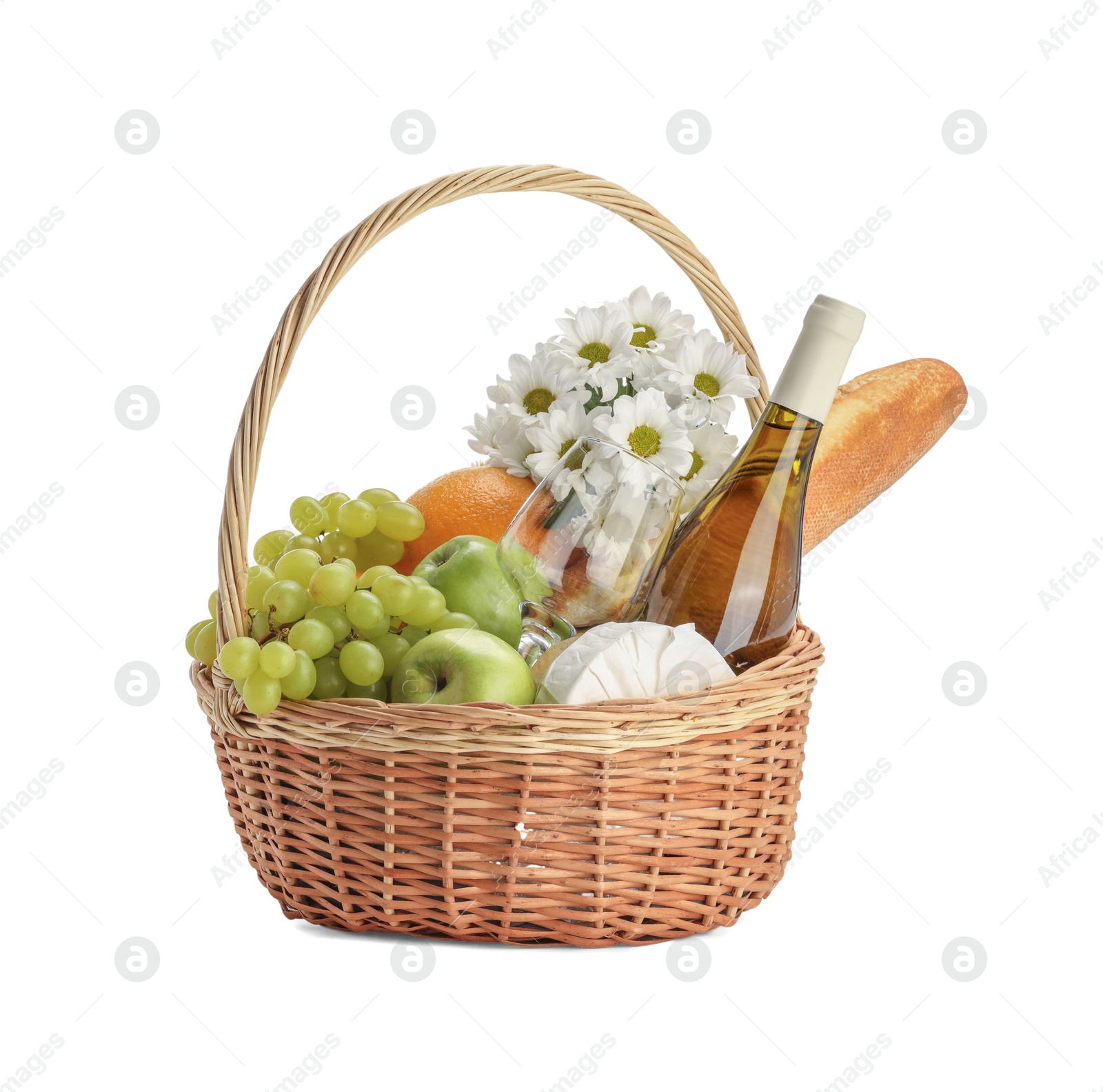 Photo of Picnic basket with flowers, food and wine isolated on white