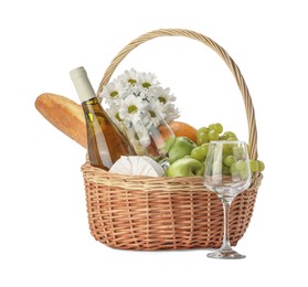 Photo of Picnic basket with flowers, food and wine isolated on white