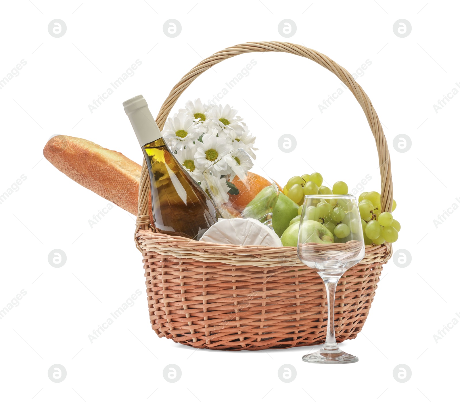 Photo of Picnic basket with flowers, food and wine isolated on white