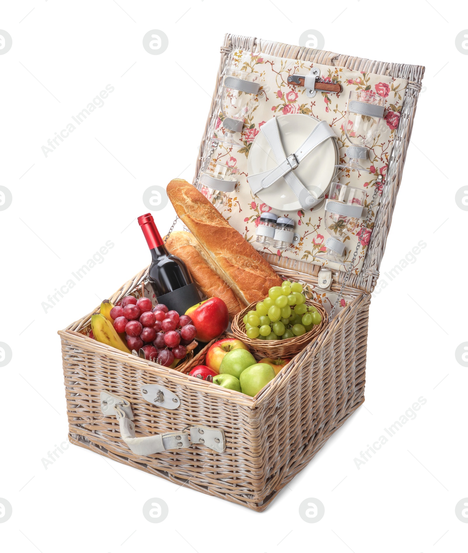 Photo of Picnic basket with tableware, food and wine isolated on white