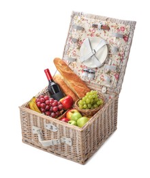 Photo of Picnic basket with tableware, food and wine isolated on white