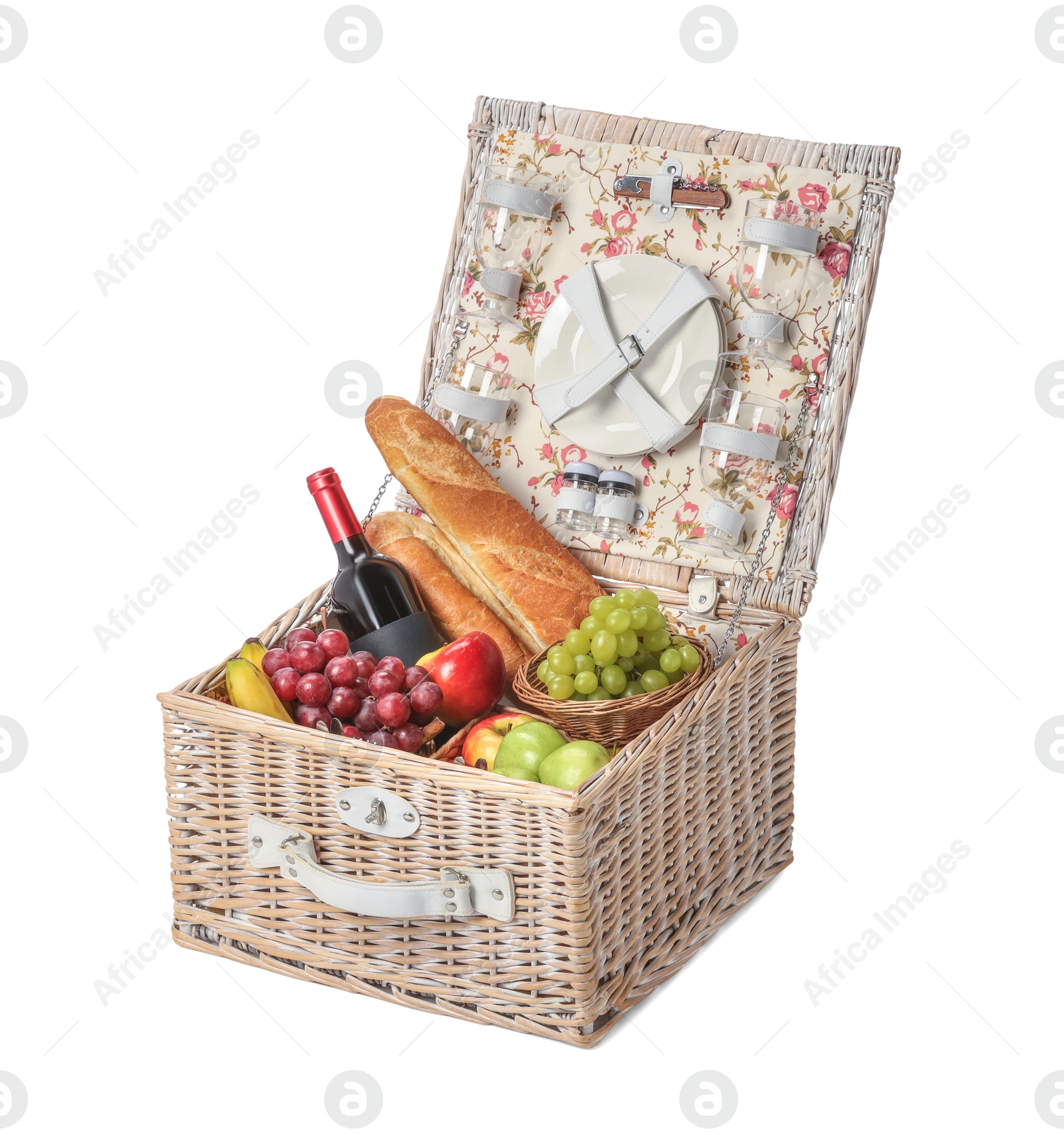 Photo of Picnic basket with tableware, food and wine isolated on white