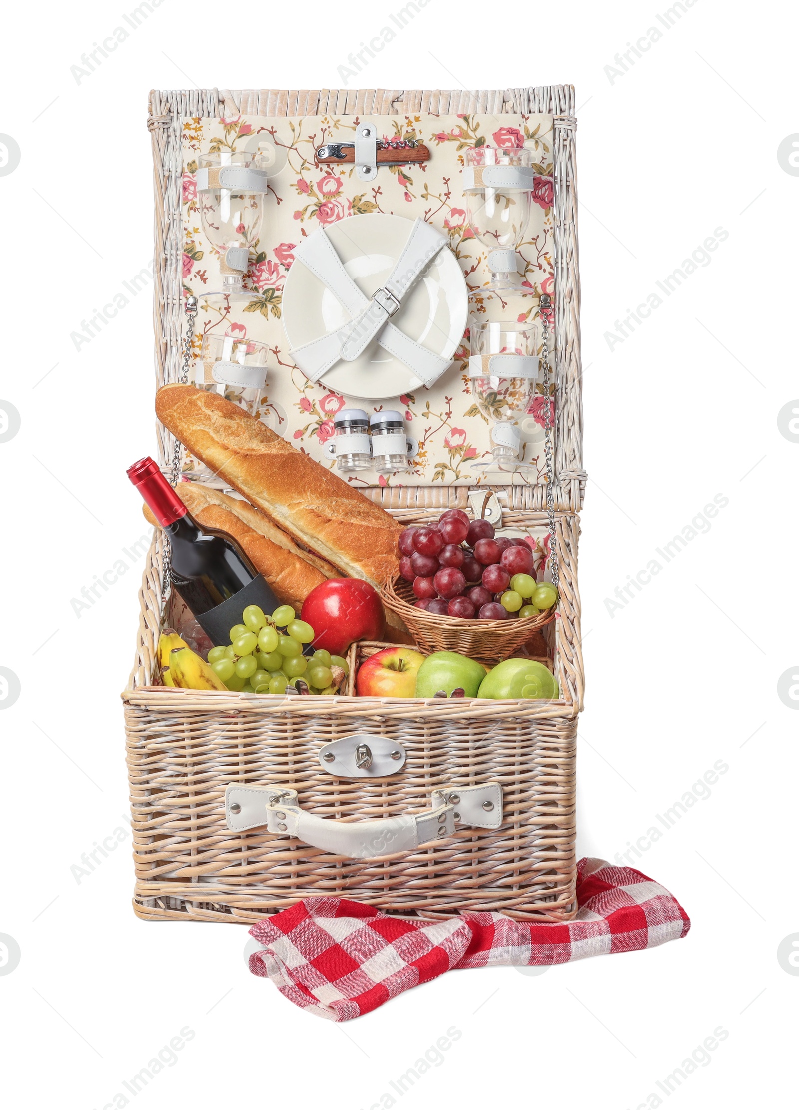 Photo of Picnic basket with tableware, food and wine isolated on white