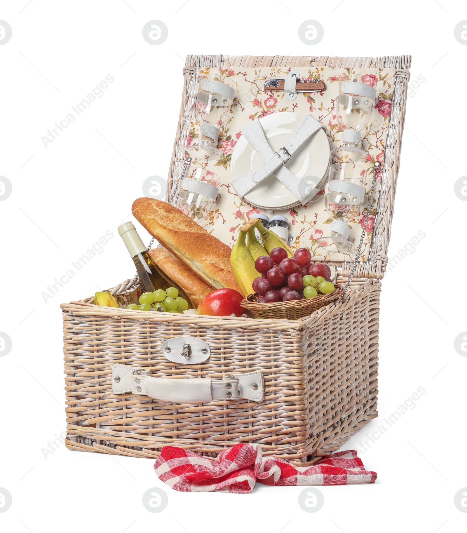 Photo of Picnic basket with tableware, food and wine isolated on white