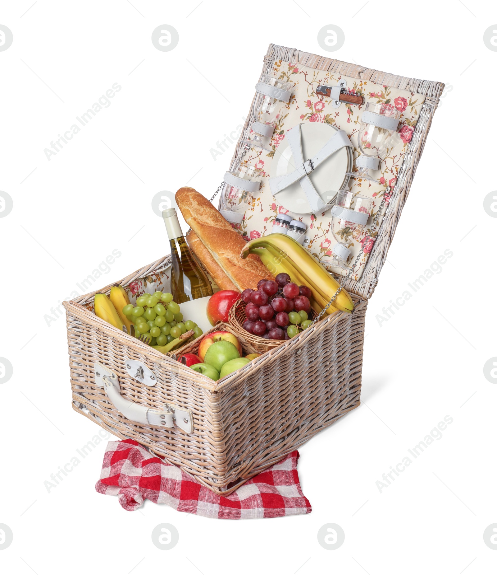 Photo of Picnic basket with tableware, food and wine isolated on white