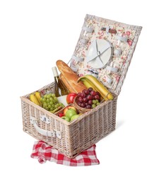 Photo of Picnic basket with tableware, food and wine isolated on white