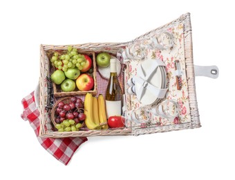 Photo of Picnic basket with tableware, food and wine isolated on white, top view