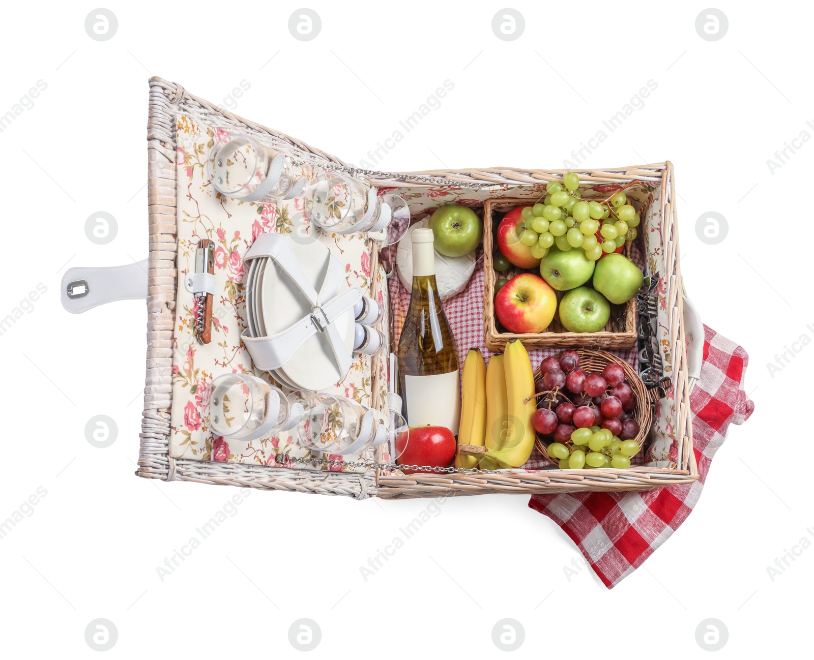 Photo of Picnic basket with tableware, food and wine isolated on white, top view