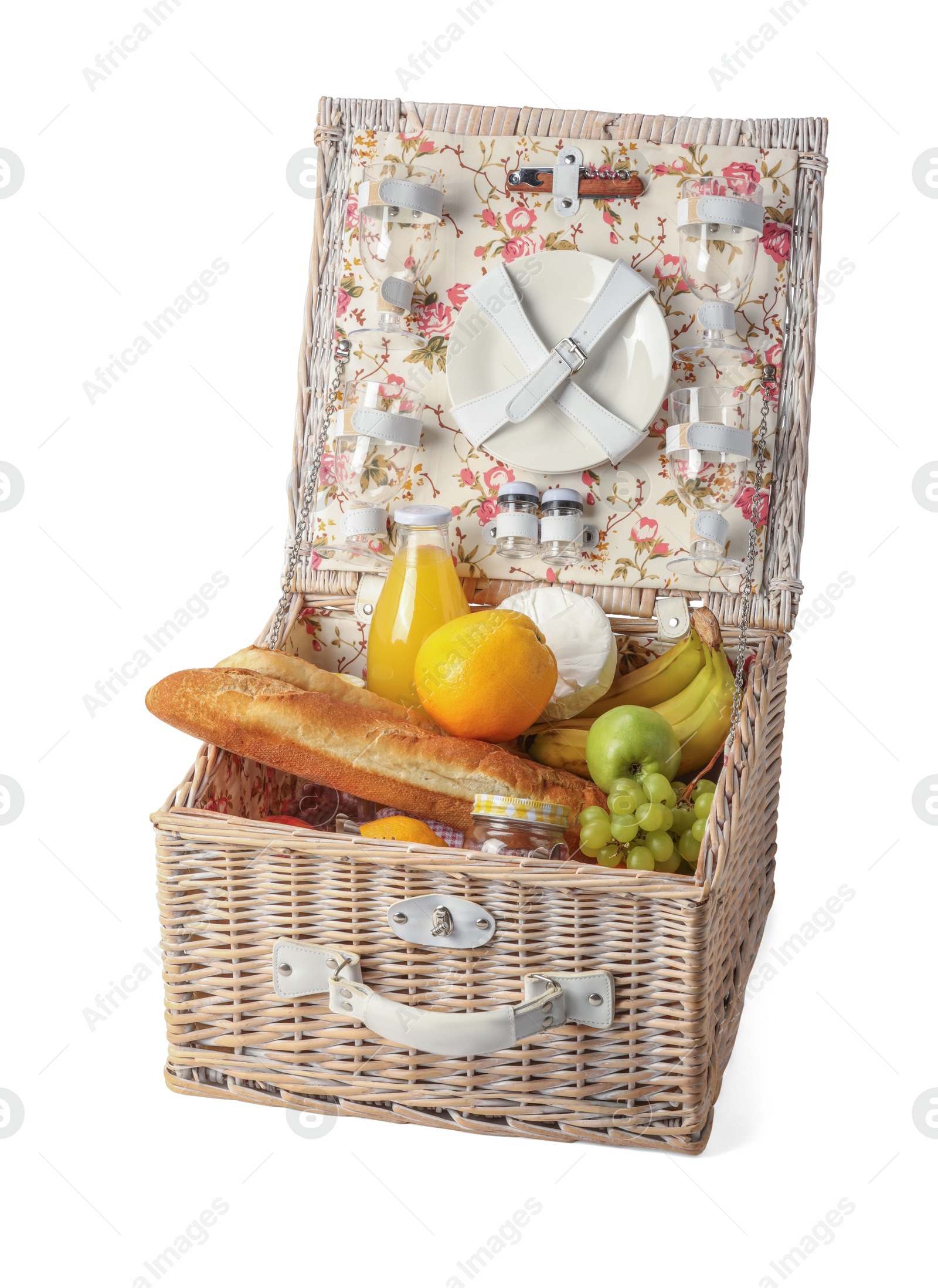 Photo of Picnic basket with tableware, food and drink isolated on white