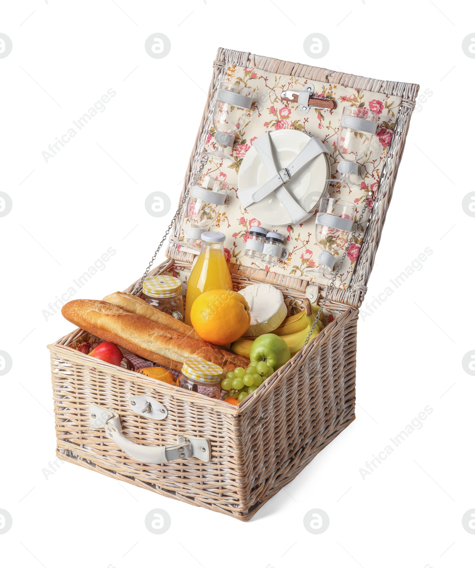 Photo of Picnic basket with tableware, food and drink isolated on white