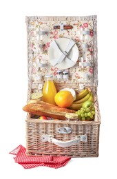 Photo of Picnic basket with tableware, food and drink isolated on white